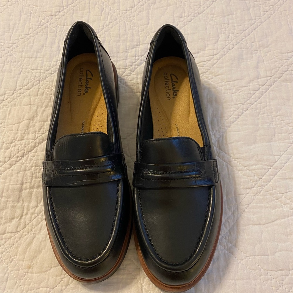 Clarks black lug sole loafers. Size 9. Never worn.